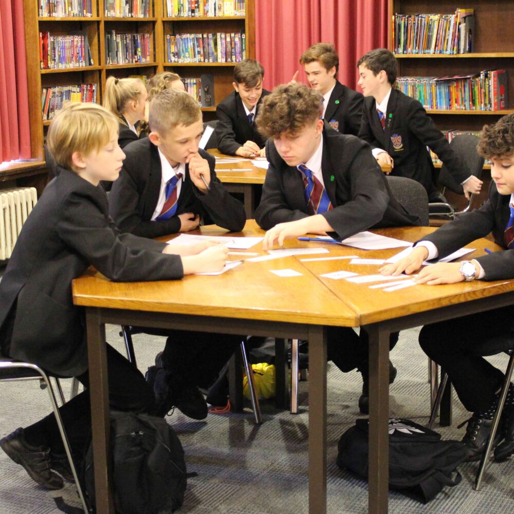 A group of students work on their equalities activity