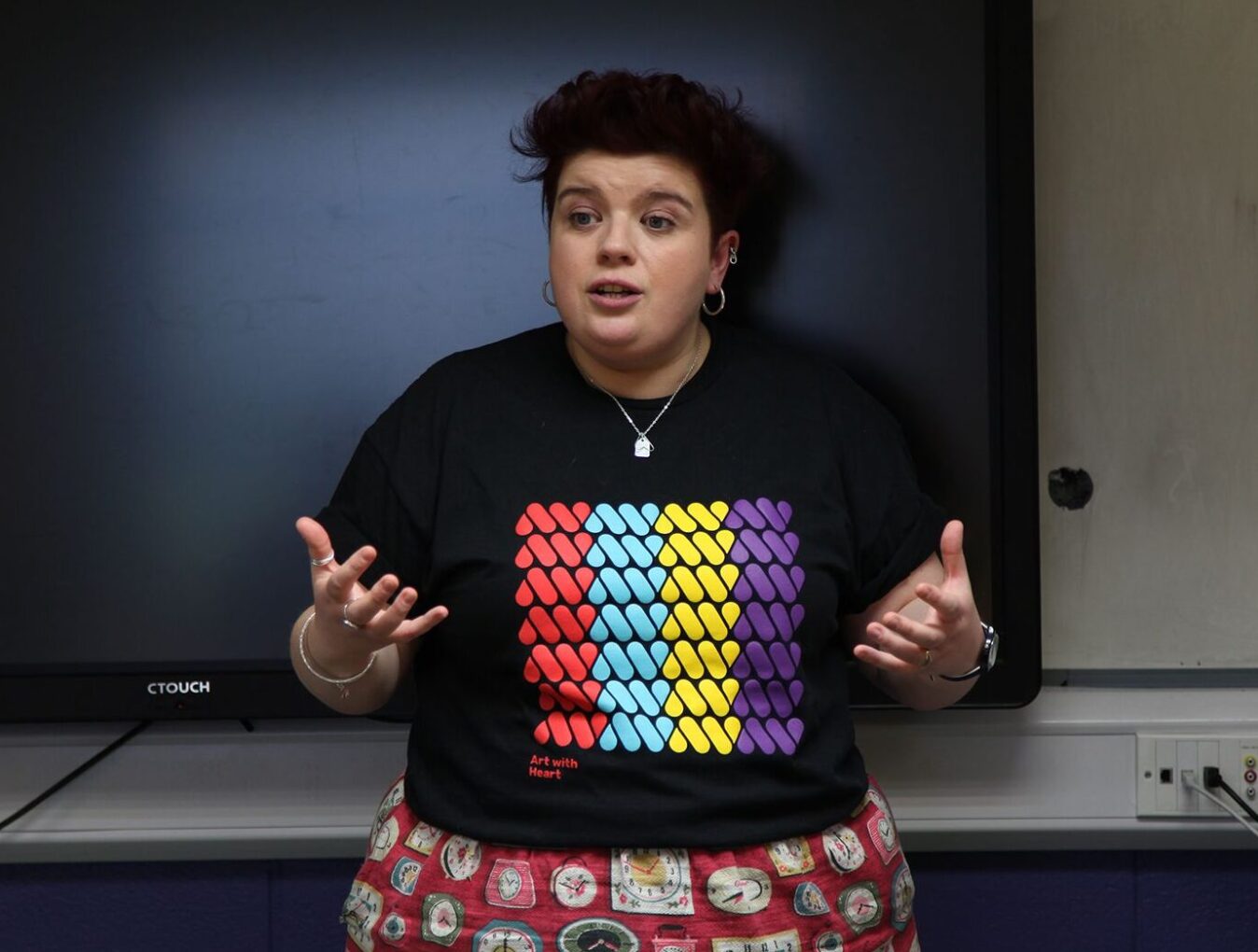 Sarah speaking to participants at the front of a classroom