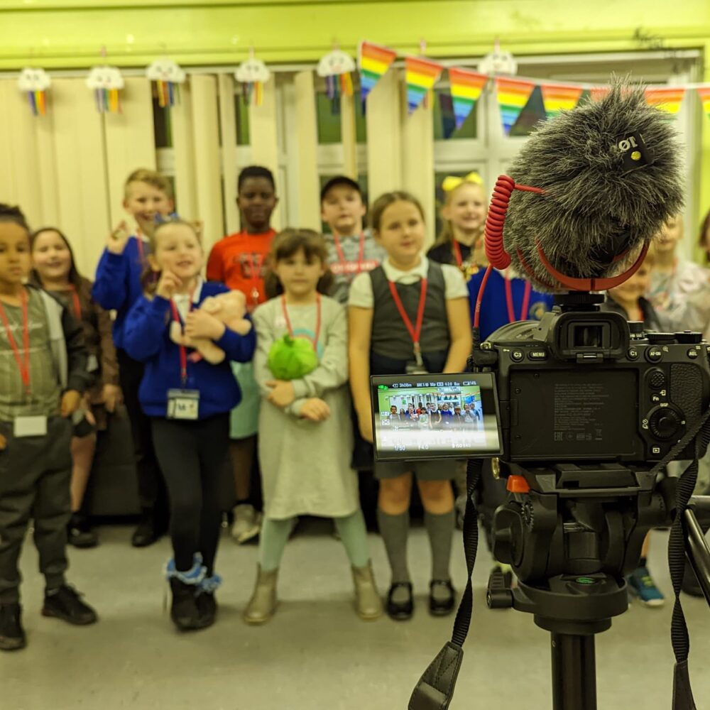 Children from Newton Heath film for their community video project.
