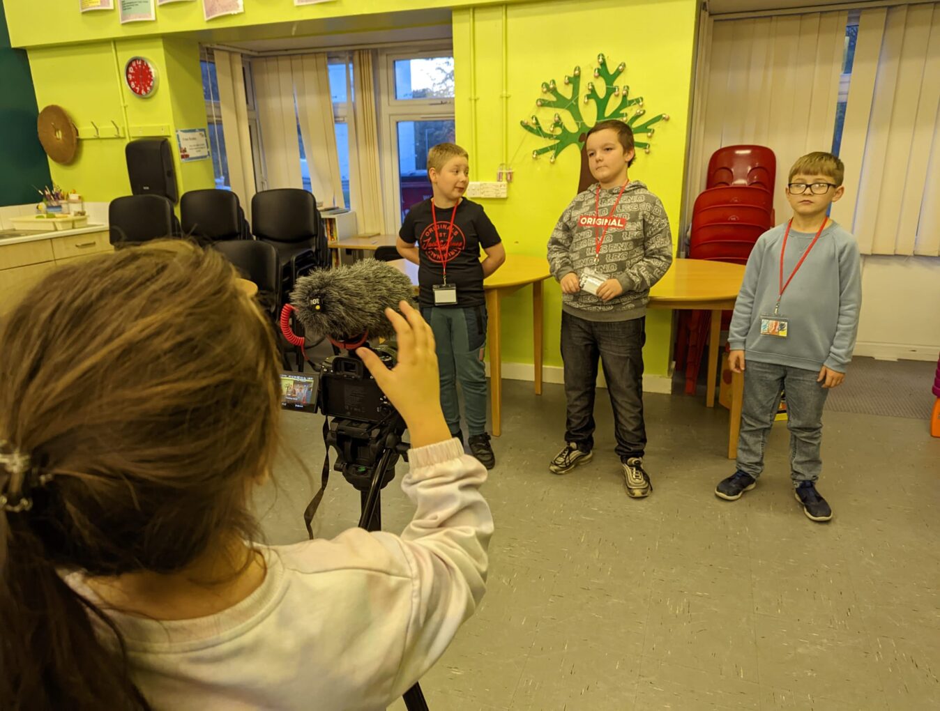 Children filming one another for a mini documentary.