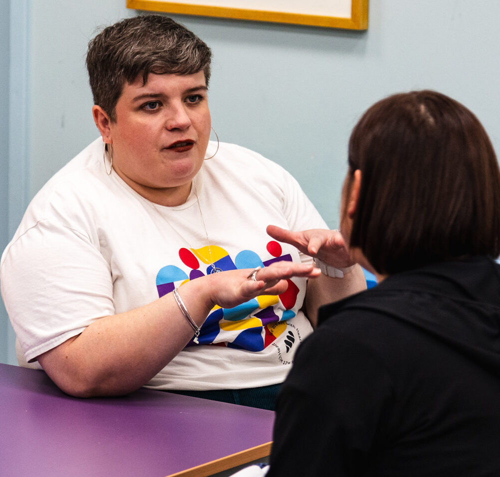 Sarah chatting during an advice session with a freelance artist