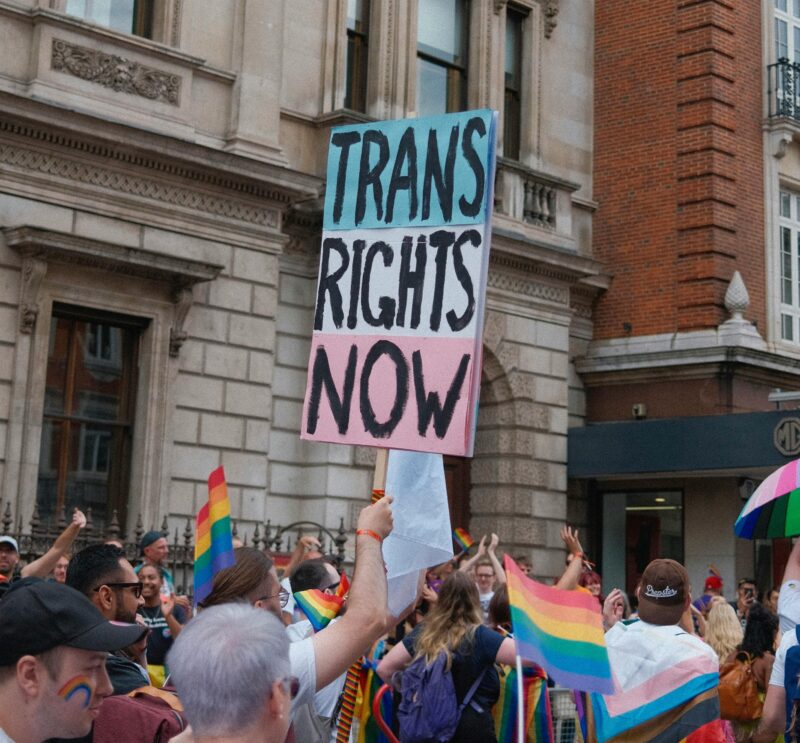 A sign that reads 'trans rights now' as part of a protest in Manchester