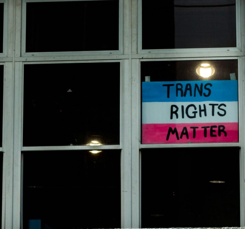 A window poster that reads 'trans rights matter'