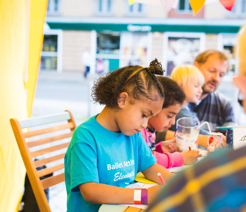 A child drawing at a pop up event