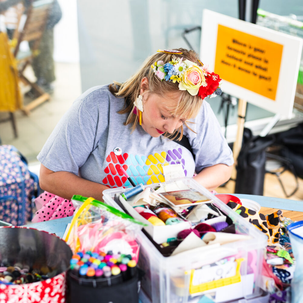 Artist Phoebe working on her stall