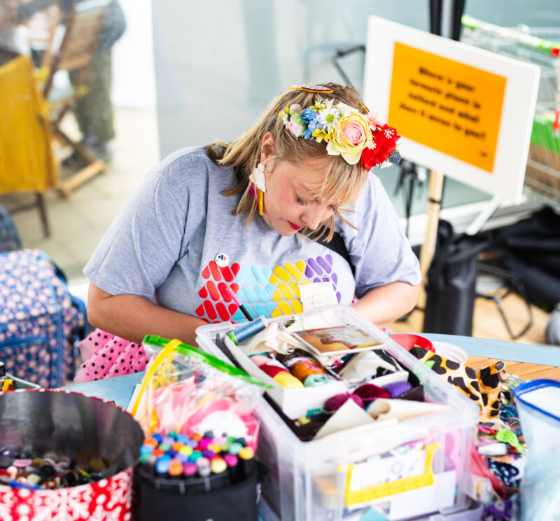Artist Phoebe working on her stall