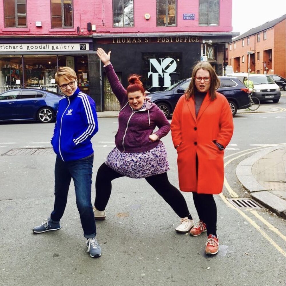 Megan, Rach and Sarah striking silly poses in Manchester's Northern Quarter