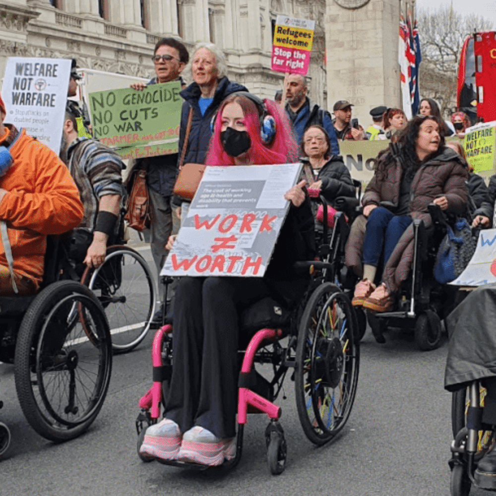 Disabled people and allies protest against the cuts.