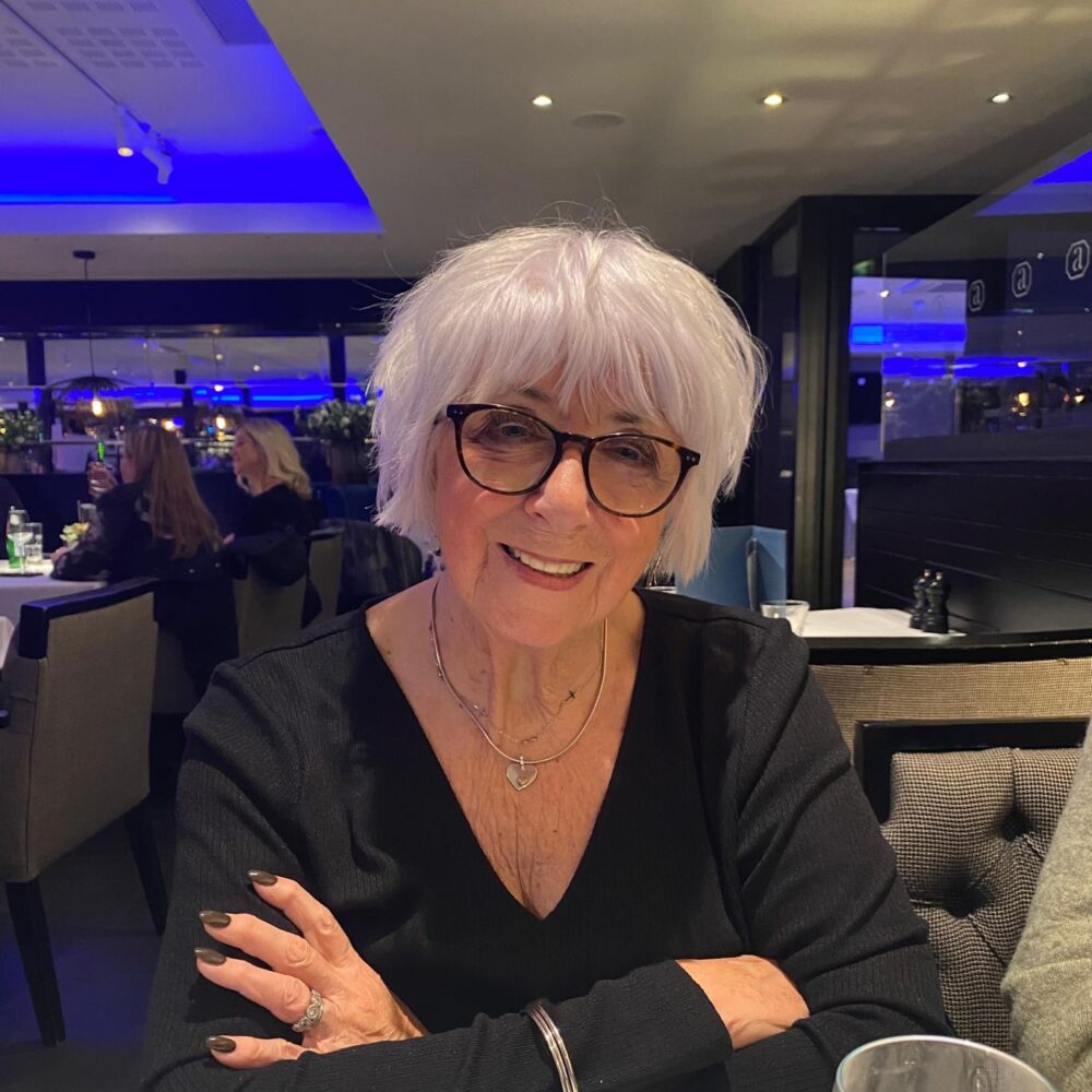 Linda Taylor smiles in a restaurant