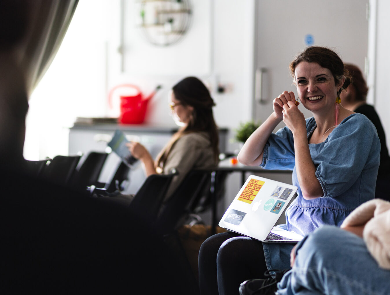 A participant is smiling during a workshop